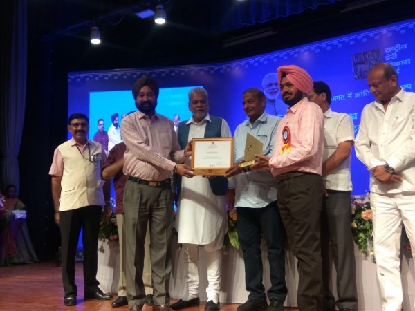 Mohali Dairy recieving the Innovation Award at NDDB Anand on World Milk Day